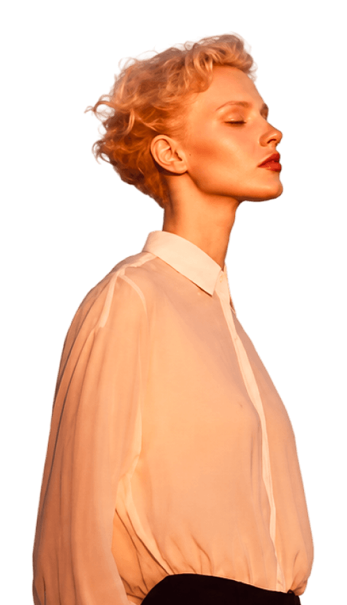 Woman in a peach shirt, seen in profile