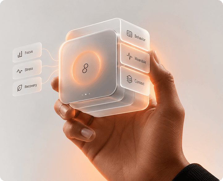Hand holding a glass cube with data panels