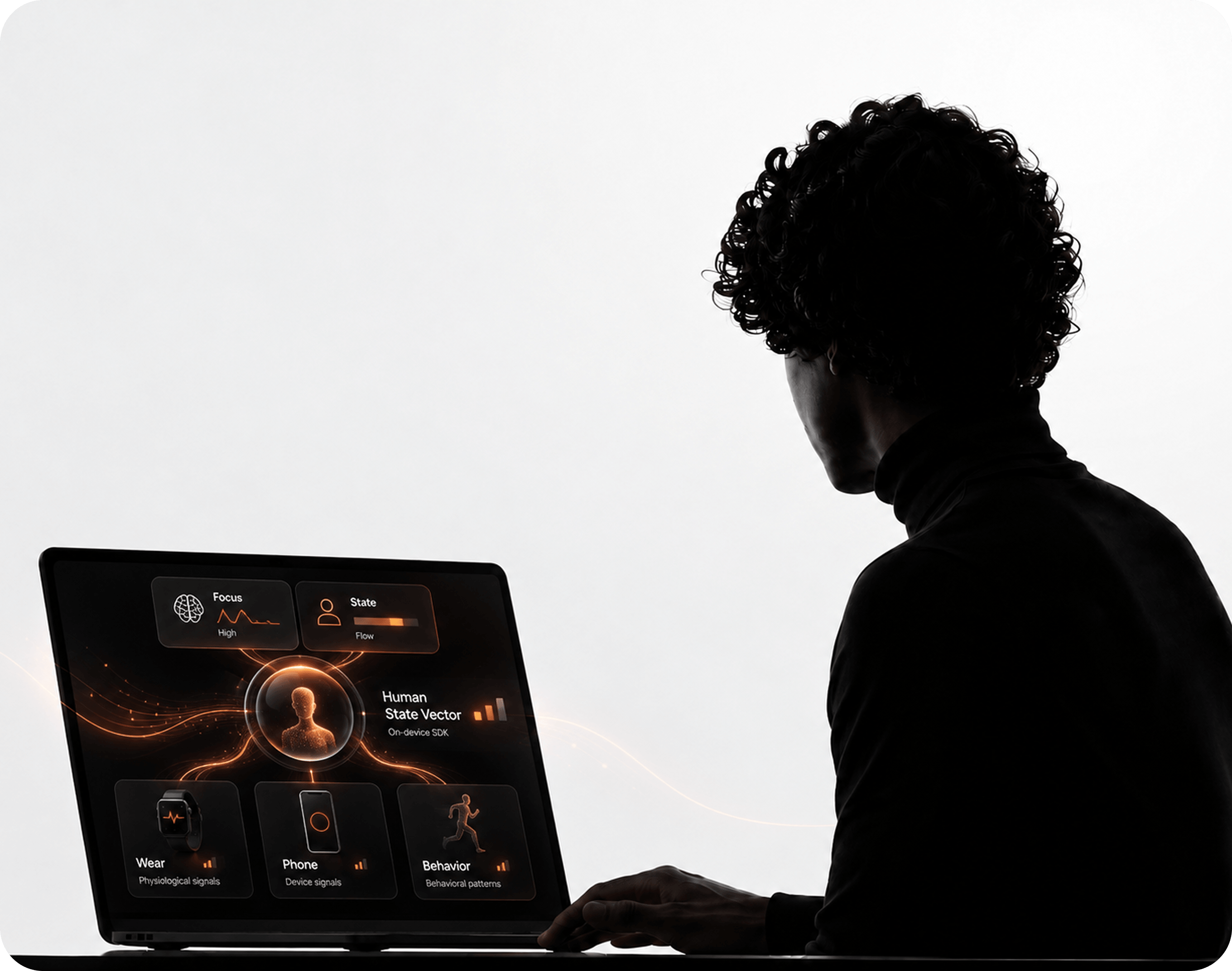 Person working at a laptop showing a human-state app