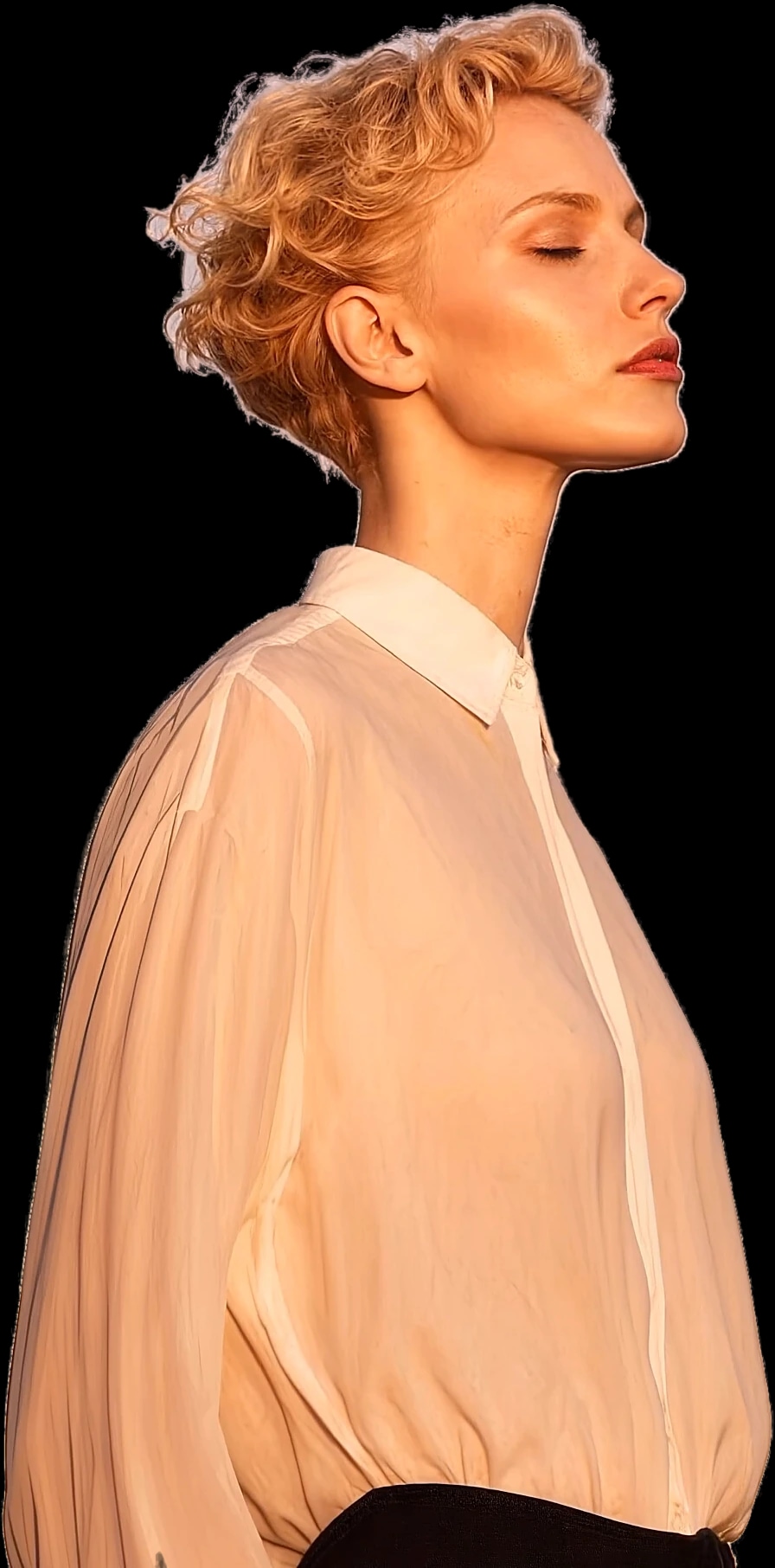 Woman in a peach shirt, seen in profile