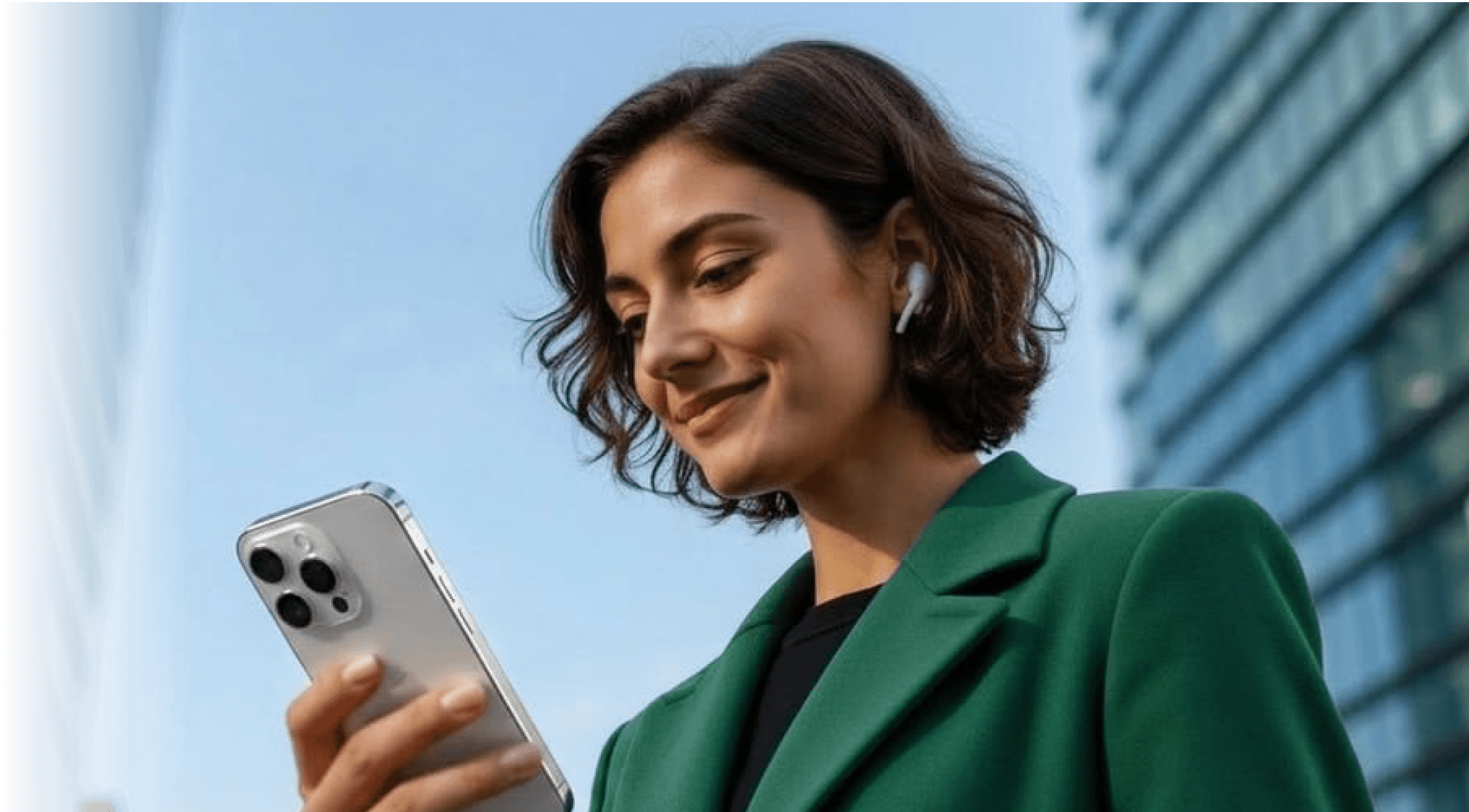 Woman smiling at her phone