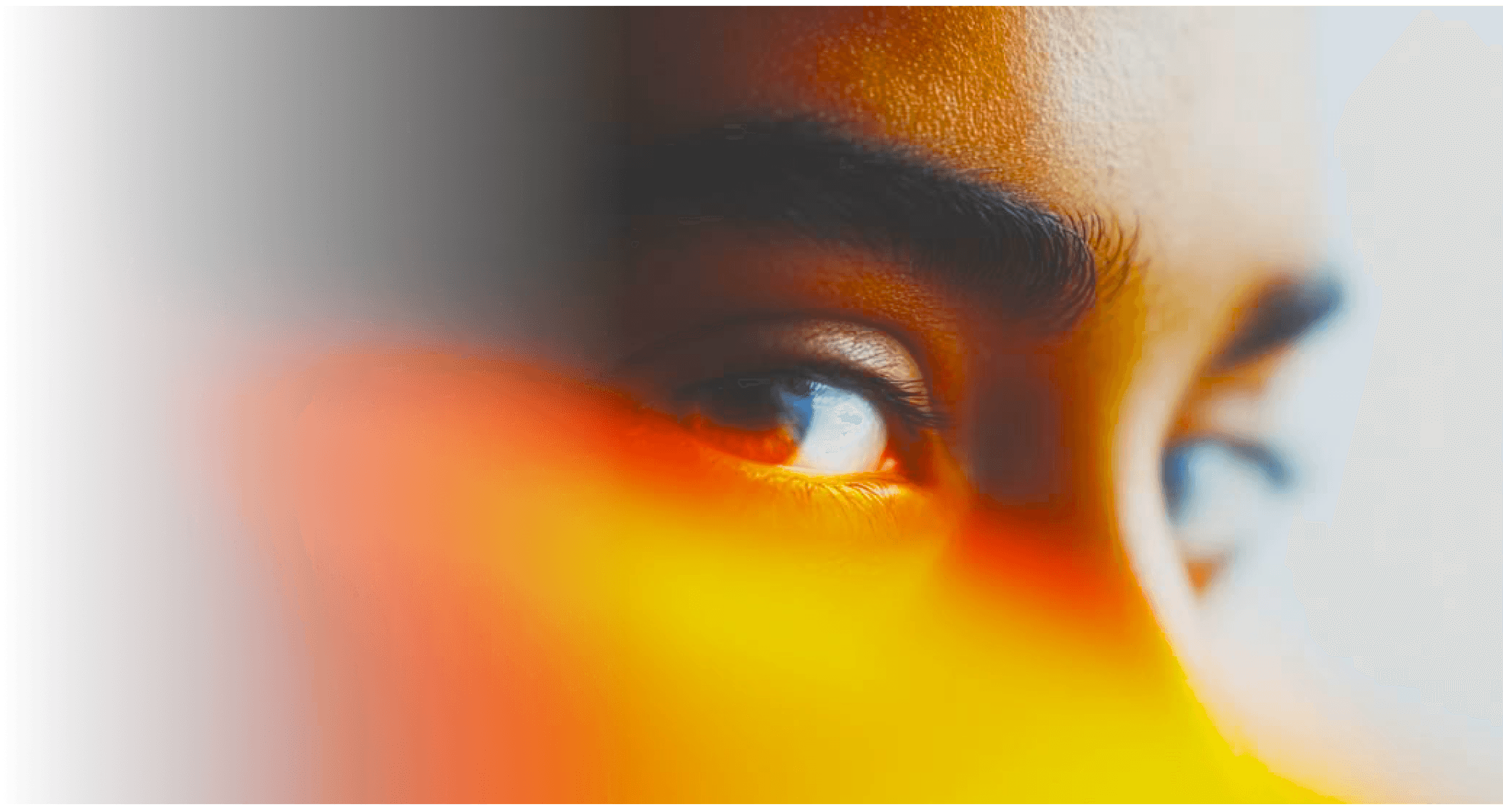 Close-up of an eye in orange light