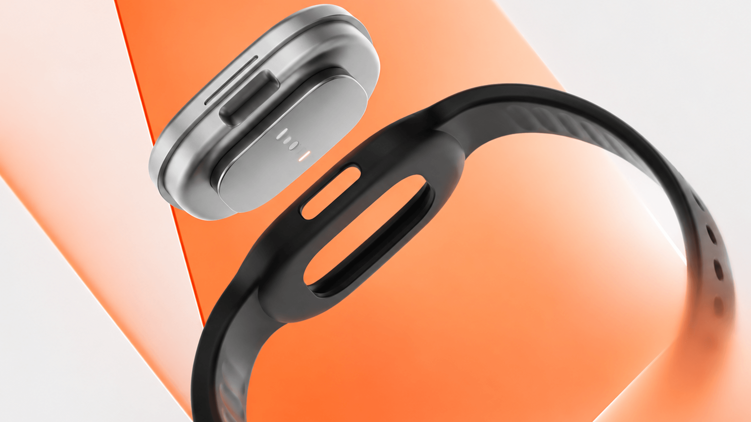 Wearable band with a sensor pod against an orange background