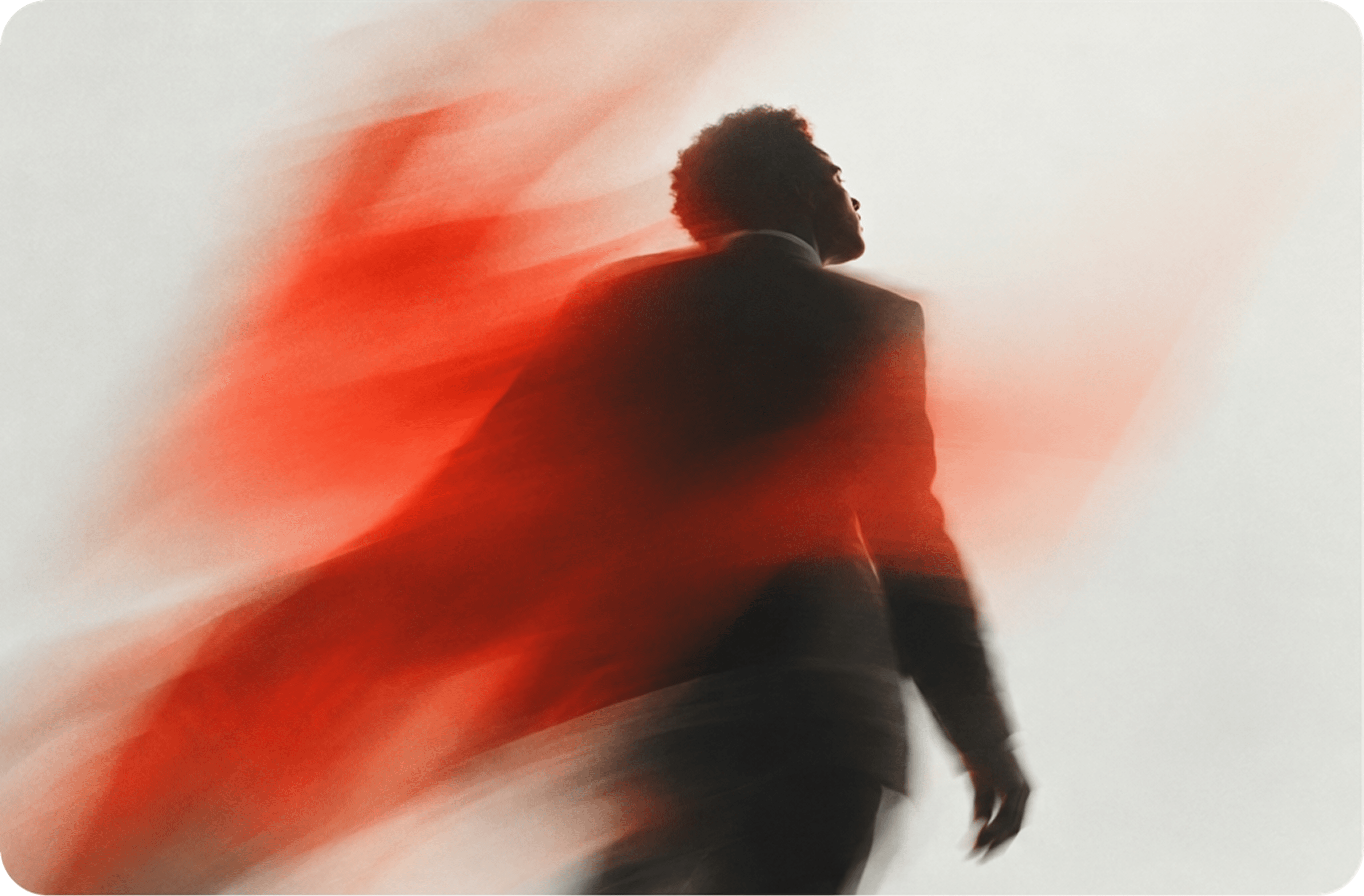 Dancer in motion with a red cloak